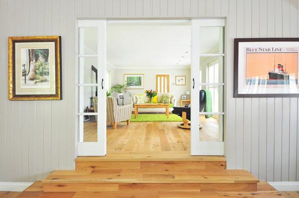 doorway looking into living room with green rug